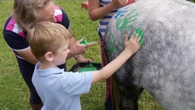 Ollie Wilson, who is autistic, at "Horses and Handprints"