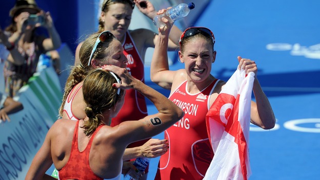 England's Jodie Stimpson celebrates winning the women's triathlon.
