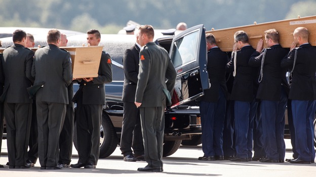 The coffins were carried from the plane during an official reception ceremony in the Netherlands after MH17 downed over rebel-held territory in eastern Ukraine.
