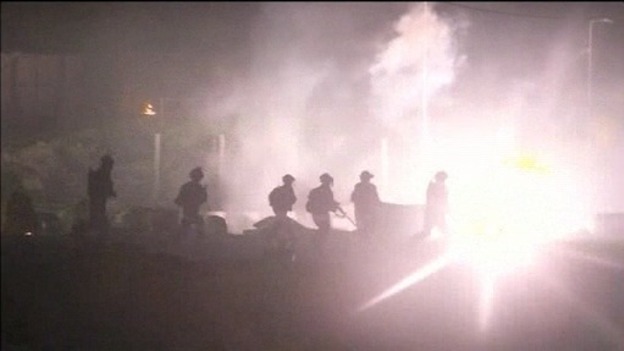 Soldiers are attacked with firebombs as clashes in Gaza continued into the night.