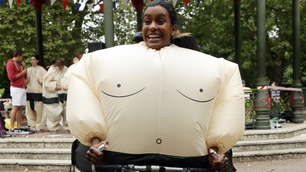 A sumo runner on a bike.