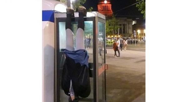 Here he is hanging from a phone box in Nottingham's Market Square.
