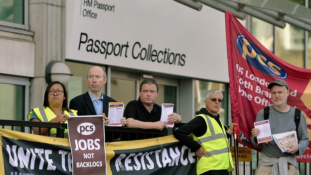 Workers outside the passport office in Victoria, central London go on strike over staff shortages.