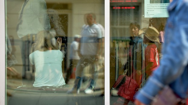 Customers wait to be served at the passport office in Victoria, central London.