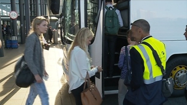 Passengers board a replacement bus