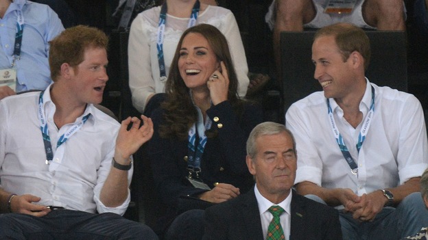 Prince Harry appears to make William and Kate lagch as they watch the action at the SSE Hydro.