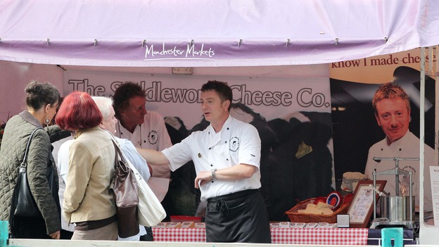 Sean Wilson at work on a market stall