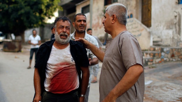 A Palestinian man cries after his son was killed during an explosion in Gaza.
