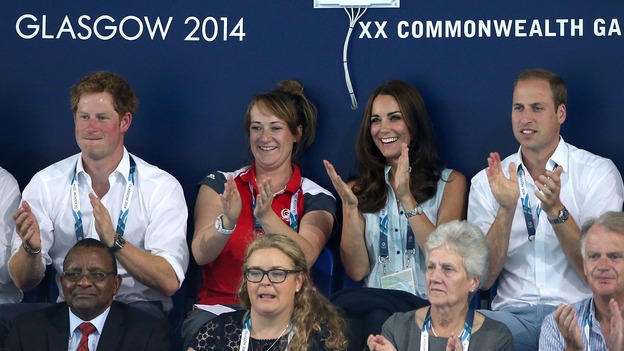 Prince Harry (left) watches a swimming session with The Duke and Duchess of Cambridge.