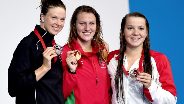 Silver medalist Lauren Boyle of New Zealand, gold medalist Jazz Carlin of Wales and bronze medalist Brittany MacClean of Canada