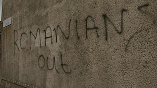A Romanian woman had racist graffiti painted on the wall of her home in East Belfast.