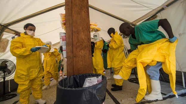 Medical staff in protective gear at an Ebola treatment centre in Sierra Leone.