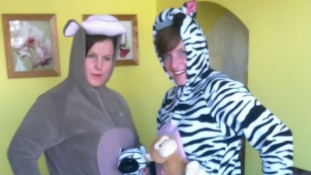 Two off-duty police officers have made an arrest while dressed in zebra and monkey onesies.