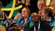 Jamaica's Usain Bolt watches the netball match between Jamaica and New Zealand in Glasgow.
