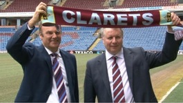 John Banaszkiewicz and Mike Garlick holding Burnley scarf
