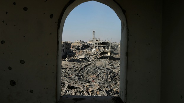 Destruction is pictured through the window of a mosque in Shejaia neighborhood, east of Gaza city.