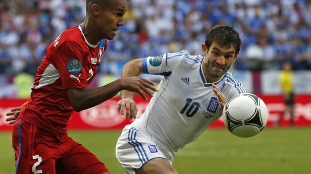 Greece's Giorgos Karagounis, right, and Czech Republic's Theodor Gebre Selassie.