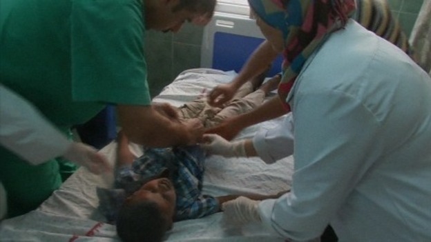 A child injured on his abdomen by shrapnel is treated in a hospital in Rafah.