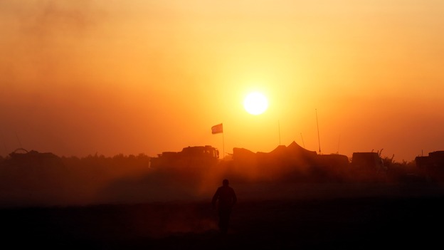 An Israeli soldier walks near the border with the Gaza Strip.