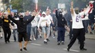 A Poland supporter makes chants towards the police.