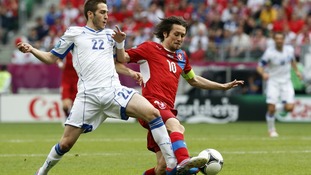 Greece's Costas Fortounis, left, and Czech Republic's Tomas Rosicky fight for the ball.