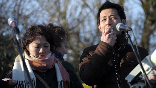 Couple from Japan talking to crowd