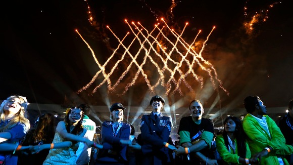 Thousands of people in the stadium locked hands for a mass performance of Auld Lang Syne. 