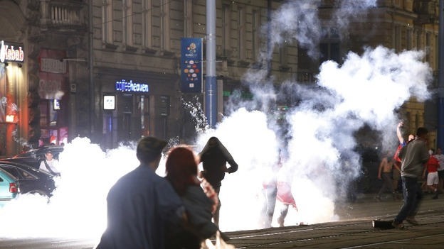 A flare is set off in Warsaw.