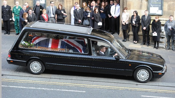 Darren Rathbanddrives the hearse carrying his brother's coffin from St Nicholas Cathedral, Newcastle