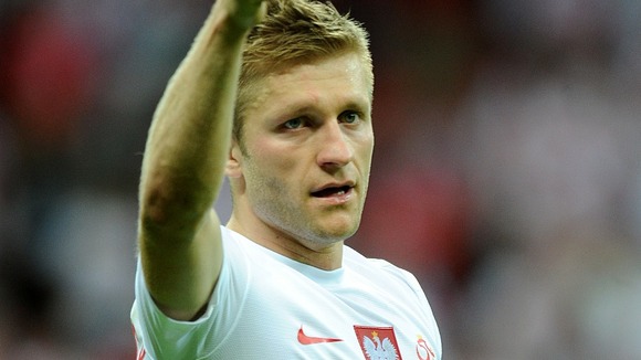 Poland's Jakub Blaszczykowski acknowledges the fans after the final whistle.