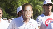 Prince Harry runs a mile for charity wearing a mask with Prince William's face on it 