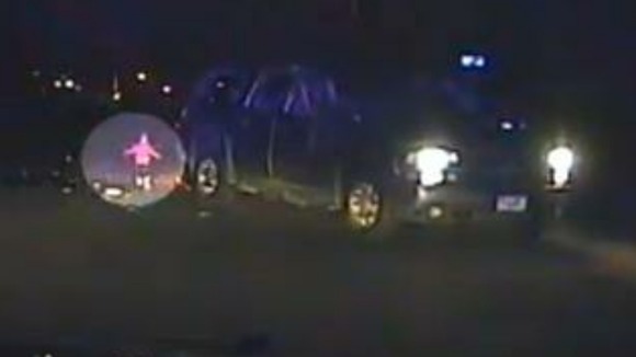 The toddler walks back towards the car after being thrown out