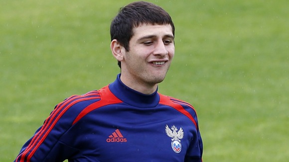Russia's Alan Dzagoev controls the ball during a training session in Sulejowek, Poland.