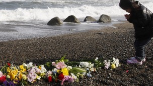 Girl prays for victims of the earthquake and tsunami in Iwaki