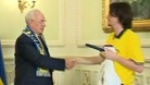 Euro 2012: Ola Sjostedt, head of the Swedish supporters club, gives Ukrainian PM his six pack of Swedish beer
