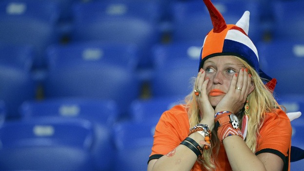 A Dutch fan looks glum after the defeat to Germany.