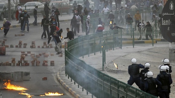 Anti-government protesters clash with riot police in Bahrain during the state's uprising.