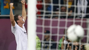 Mario Gomez celebrates against Holland