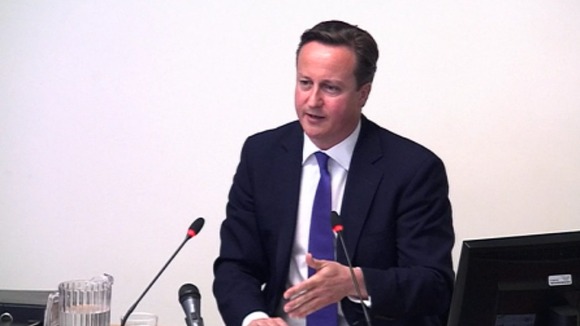 Prime Minister David Cameron giving evidence to the Leveson Inquiry