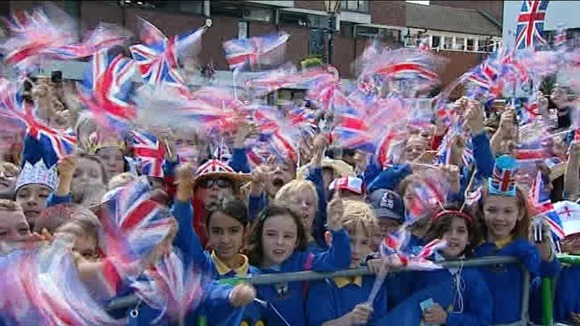 Children greet the Queen