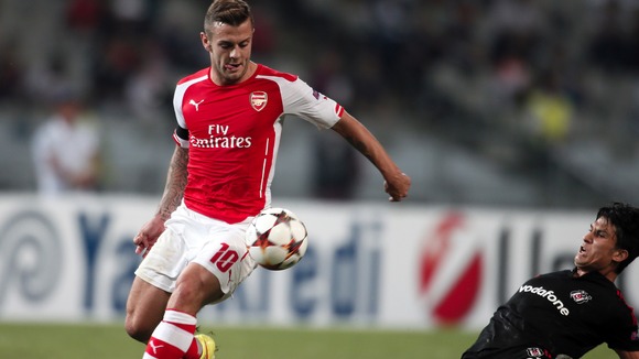 Jack Wilshere battles for the ball in the second half. Credit: PA