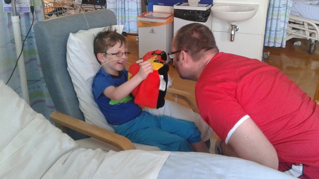 Callum recovers in hospital with his father Andy at his bedside