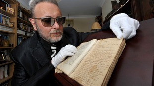 Mark Evans with book