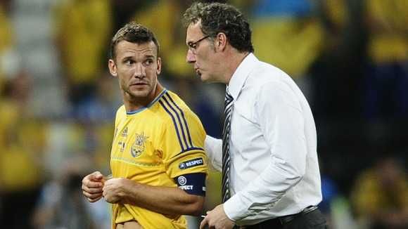 France manager Laurent Blanc consoles Andriy Shevchenko.