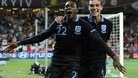 Danny Welbeck celebrates scoring England's third goal of the game with teammate Andy Carroll.