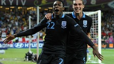 Danny Welbeck celebrates scoring England's third goal of the game with teammate Andy Carroll.
