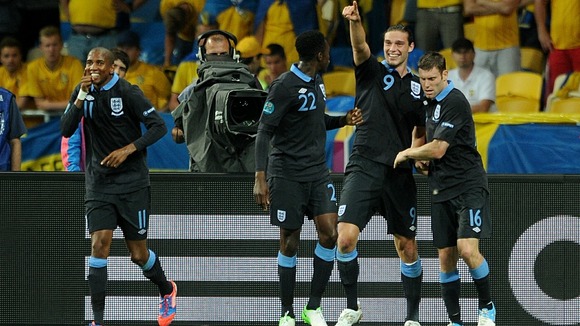 Andy Carroll celebrates scoring England's opener in Kiev.