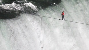 Tightrope walker Wallenda walks the high wire over the Horseshoe Falls in Niagara Falls