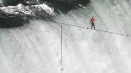 Tightrope walker Wallenda walks the high wire over the Horseshoe Falls in Niagara Falls