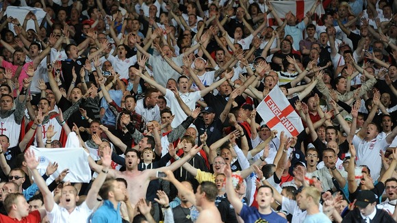England fans celebrate their third goal scored by Danny Welbeck, in the stands